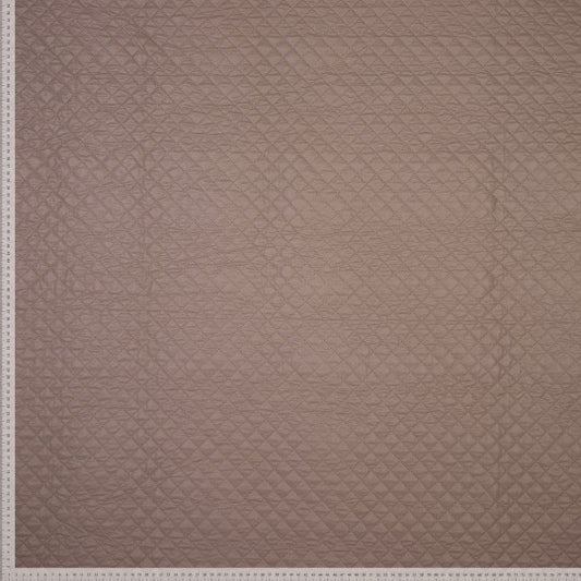 trozo de tela acolchada en rombos beige
